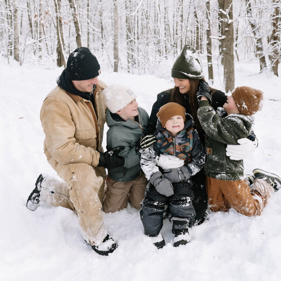 The family behind Mikutowski Woodworking on a snowy winter day