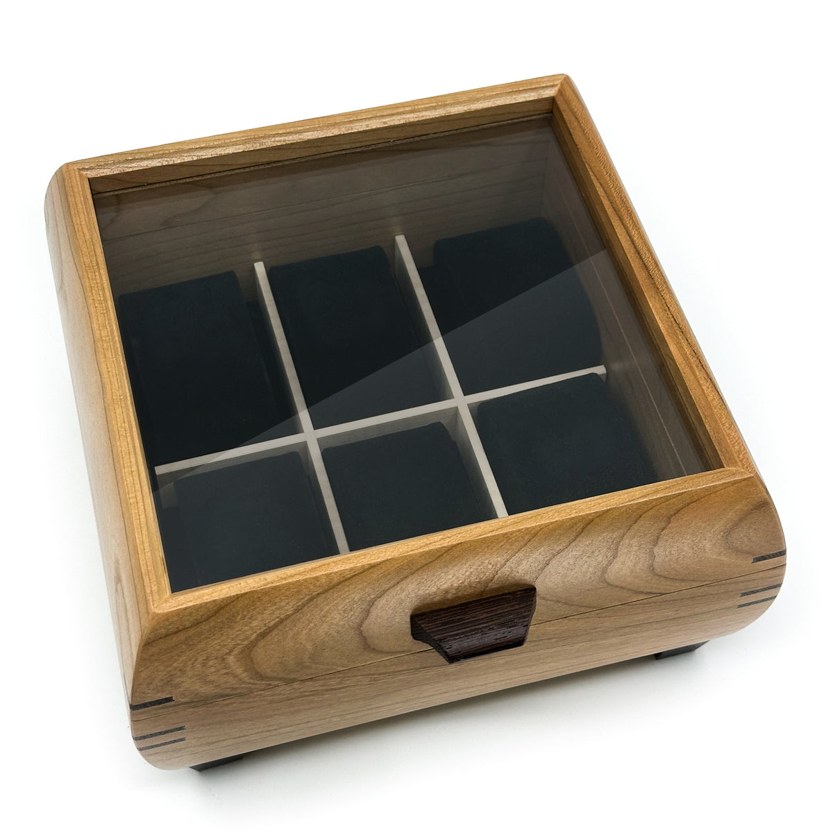 Cherry watch box from above, glass lid over six compartments