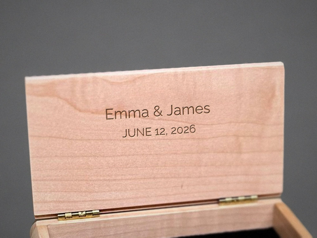 Centered message engraved inside the lid of a curly maple trinket box