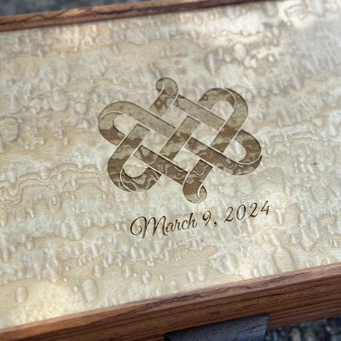 Celtic knot and wedding date engraved on a birdseye maple lid