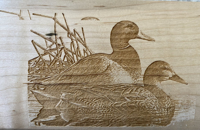 Custom mallard duck artwork laser-engraved on maple