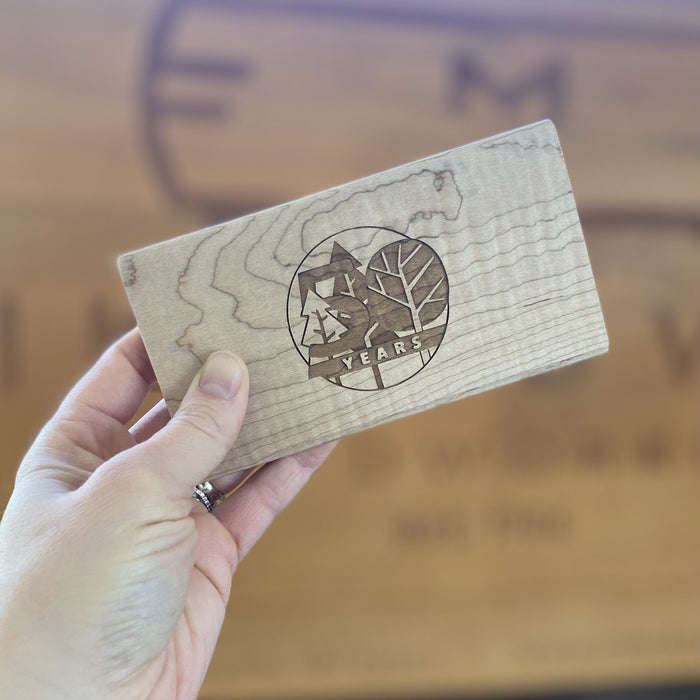 50th anniversary forestry logo engraved on a curly maple box lid