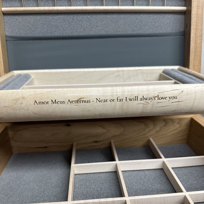 A love quote engraved on the front of a curly maple self-rising tray