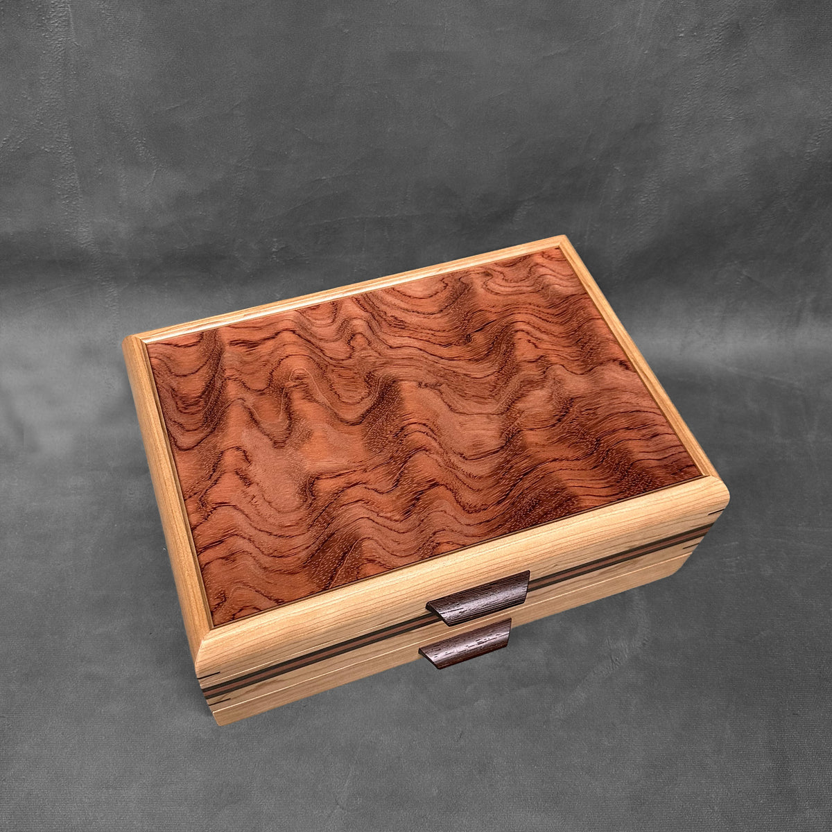 The One — October 2026 · Cherry Sophisticated Chest